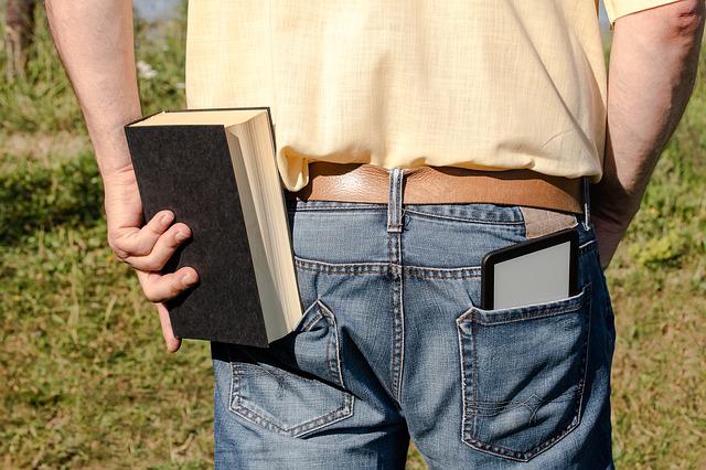 a guy holding a book