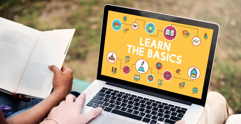 two students with a laptop, browsing a learning content management system