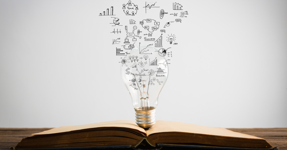 a lamp over a book symbolizing book marketing ideas