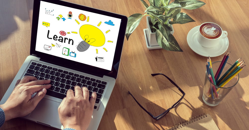 an educator using one of the best scorm authoring tools on his latptop