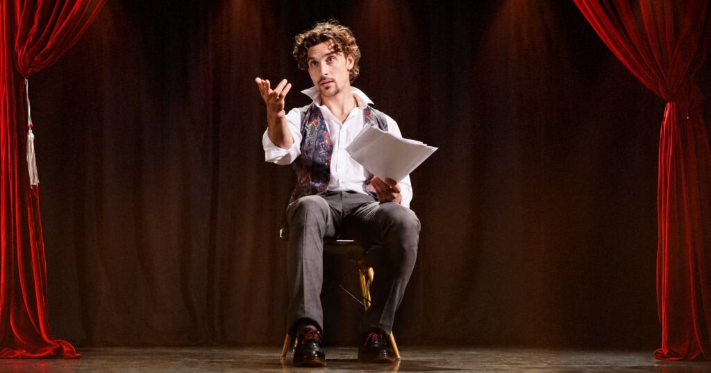 Man performing spoken word poetry on stage
